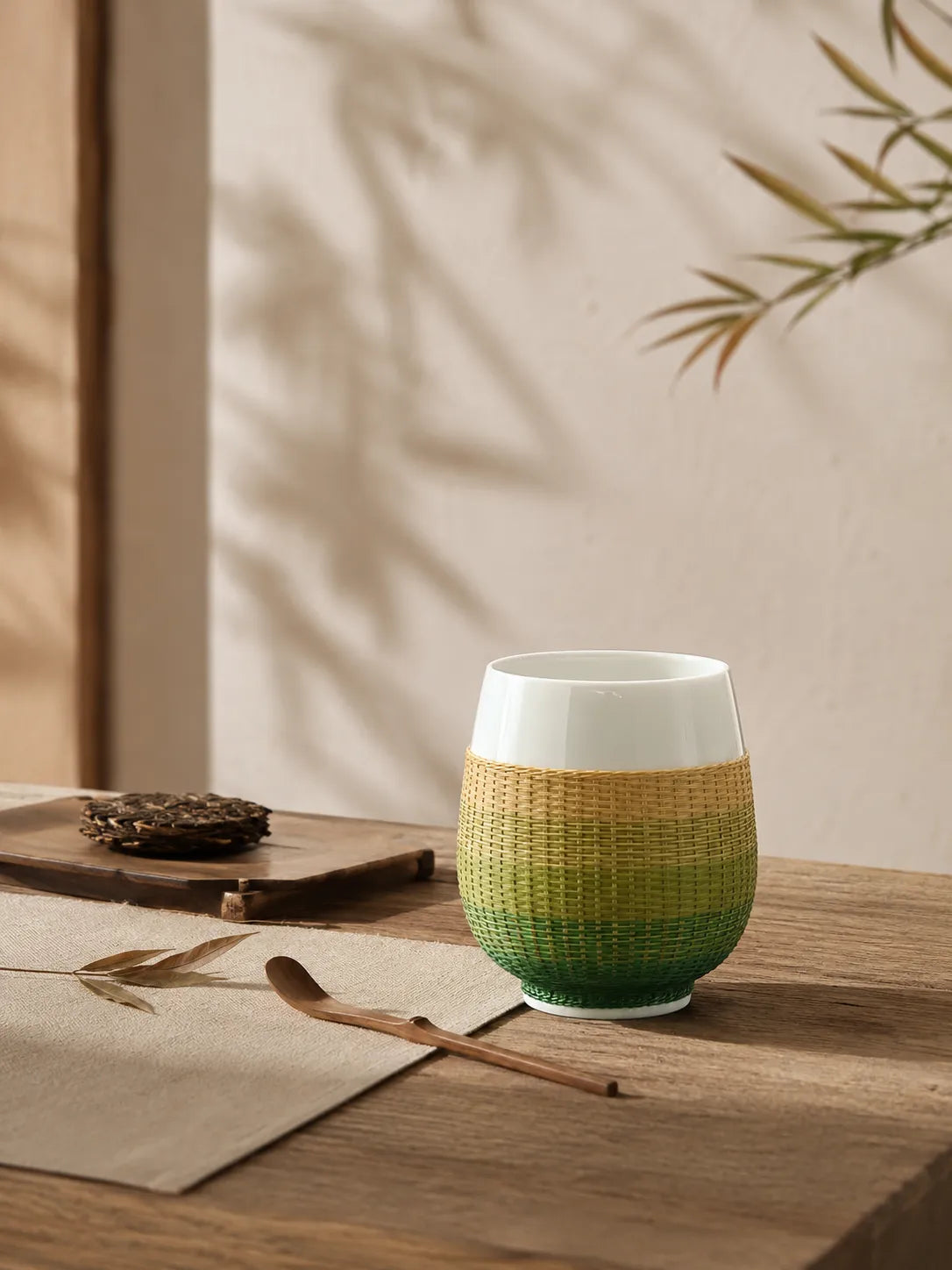 Handwoven bamboo over porcelain tea and tasting cup featuring natural bamboo texture and Dehua white porcelain craftsmanship.