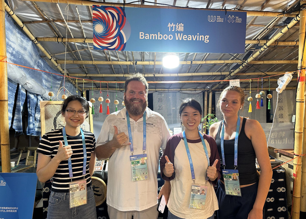 Members of Hualin Banghu Culture and Art Studio sharing bamboo weaving with international visitors at the 2025 World Games Village Cultural Bazaar in Chengdu