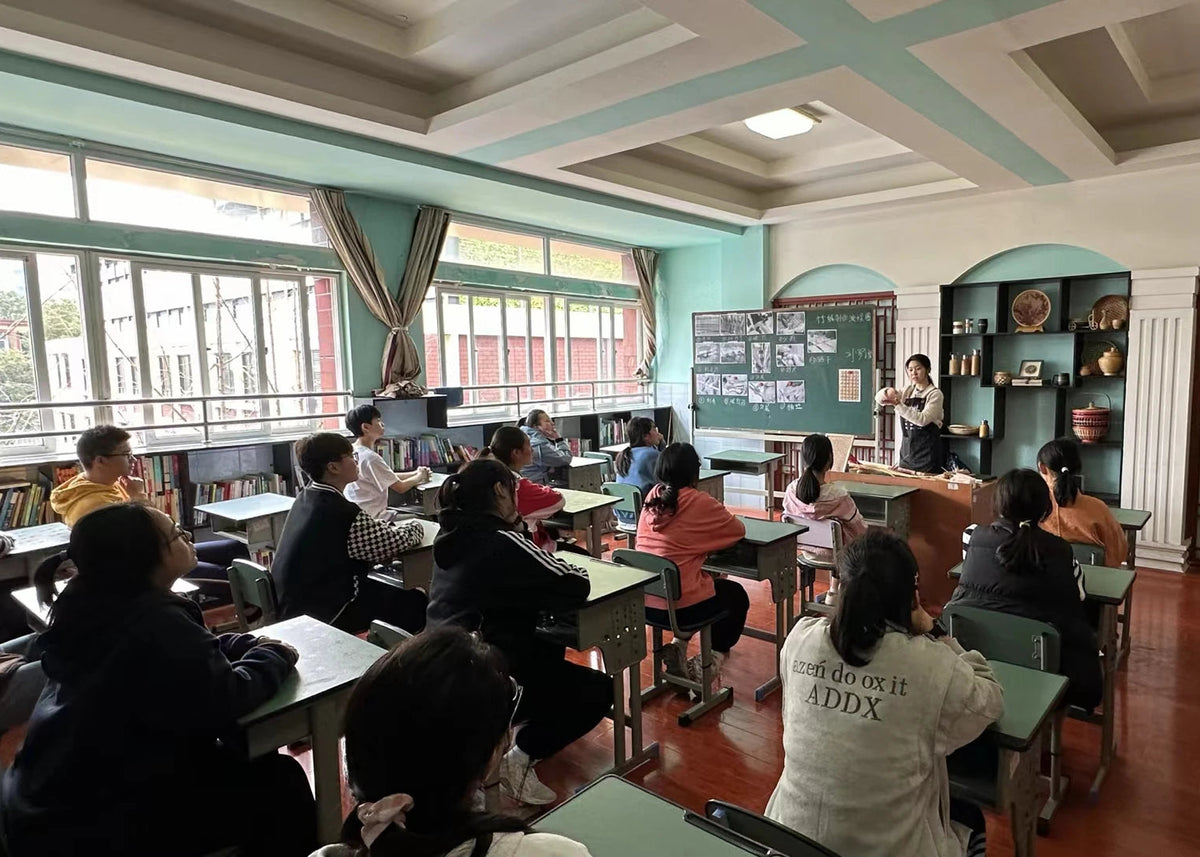 Liu Luolin teaching bamboo weaving to students in a classroom in Chengdu