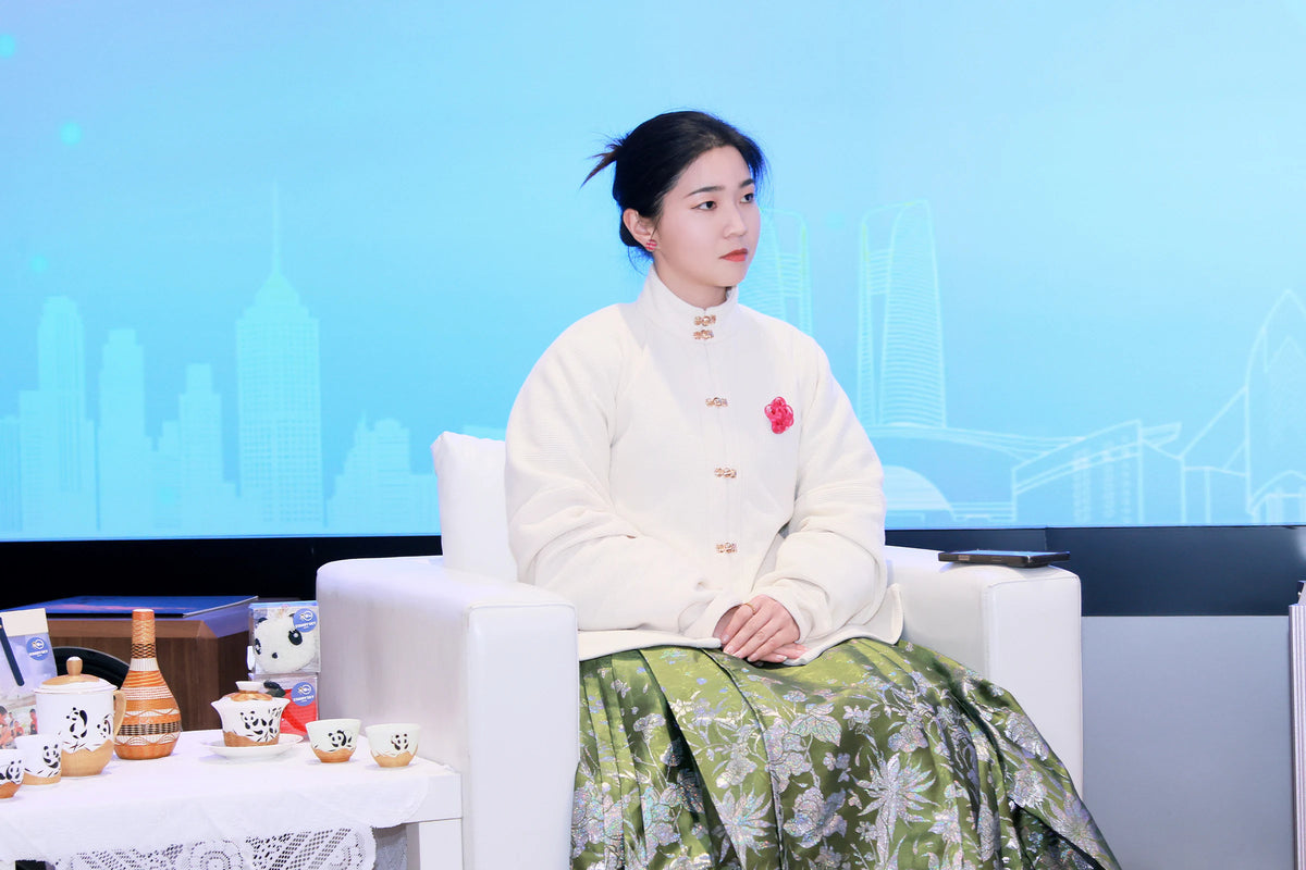 Liu Luolin during a public conversation with examples of her studio work